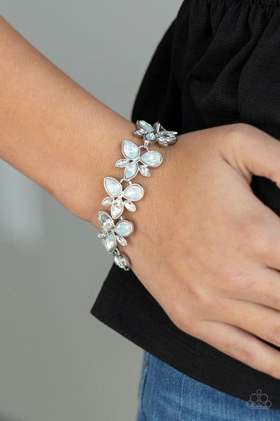 Ice Garden - Paparazzi - White Dewy Iridescent Rhinestone Floral Clasp Bracelet