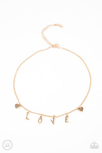 Love Conquers All - Paparazzi - Gold LOVE Choker Necklace