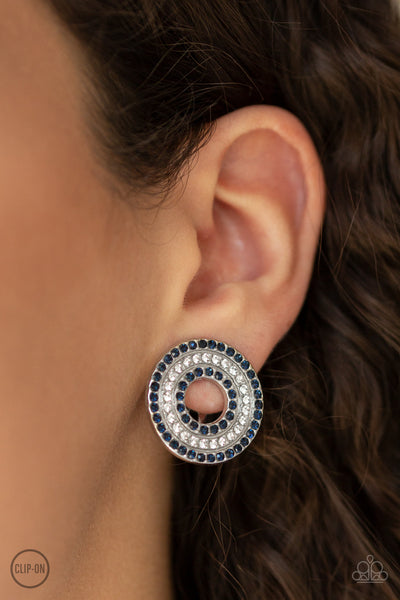 Spun Out On Shimmer - Paparazzi - Blue and White Rhinestone Circle Clip On Earrings